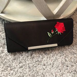 MINA BLACK CLUTCH WITH RED ROSE
